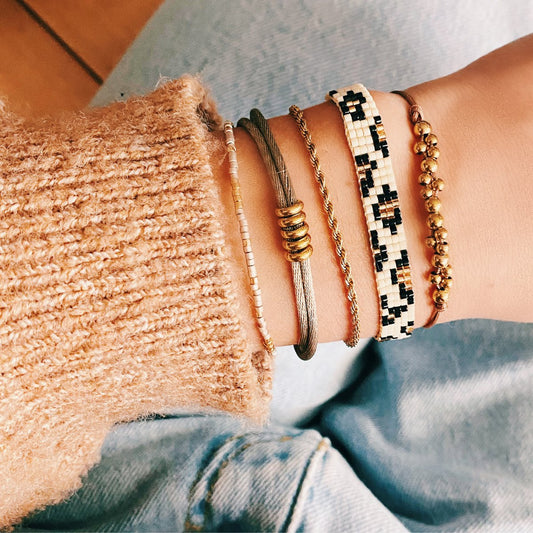 Wilde Elegantie Gevlochten Armband met Luipaardprint en Gouden Accenten