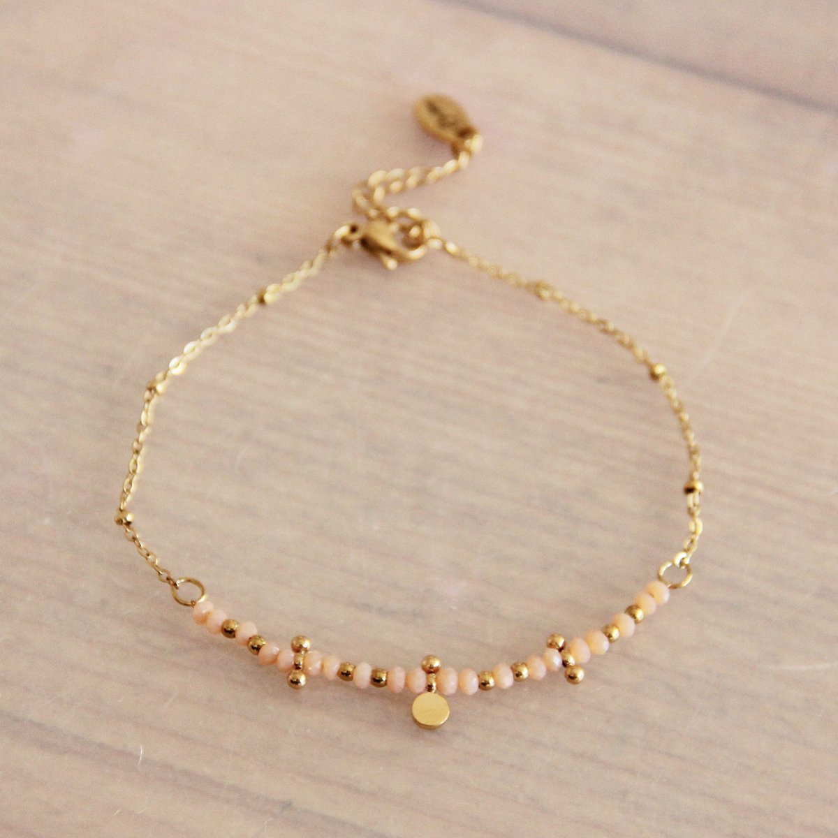 Fijne roestvrijstalen armband met facetten en kralen - Nude/Goud