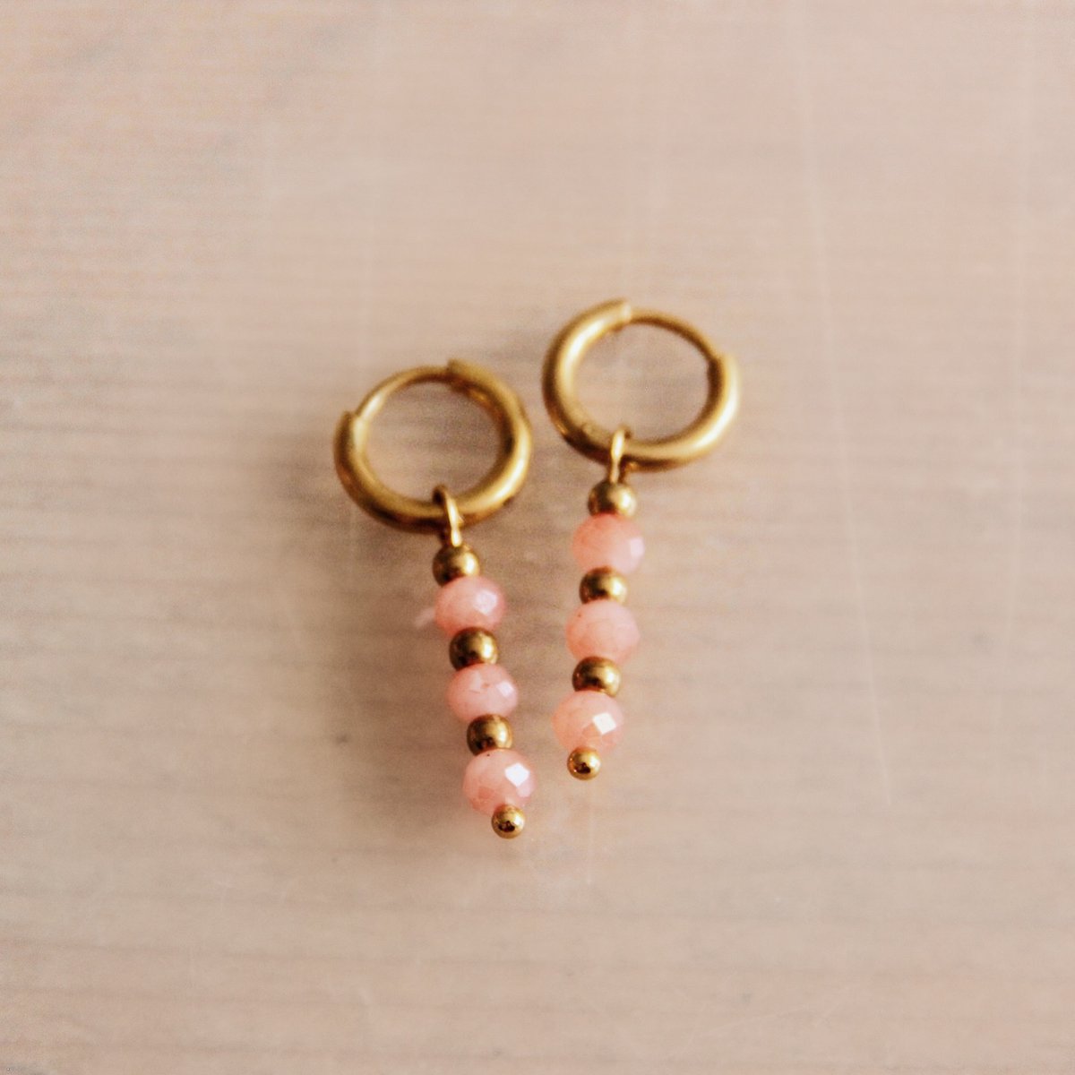 RVS oorbellen met facetten - oud roze